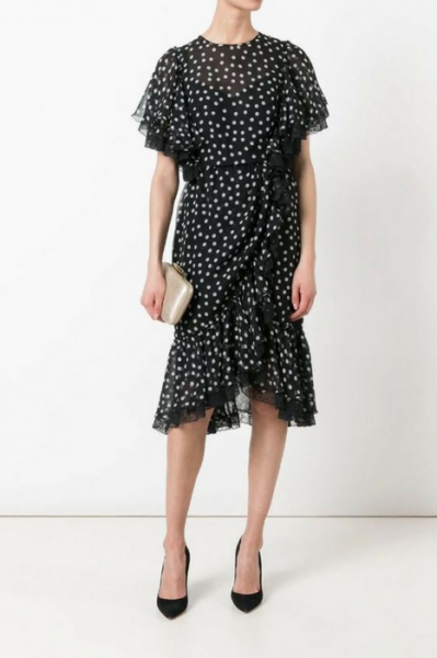 Dolce & Gabbana goes for understated charm in this simple black dress with white polka dots Image