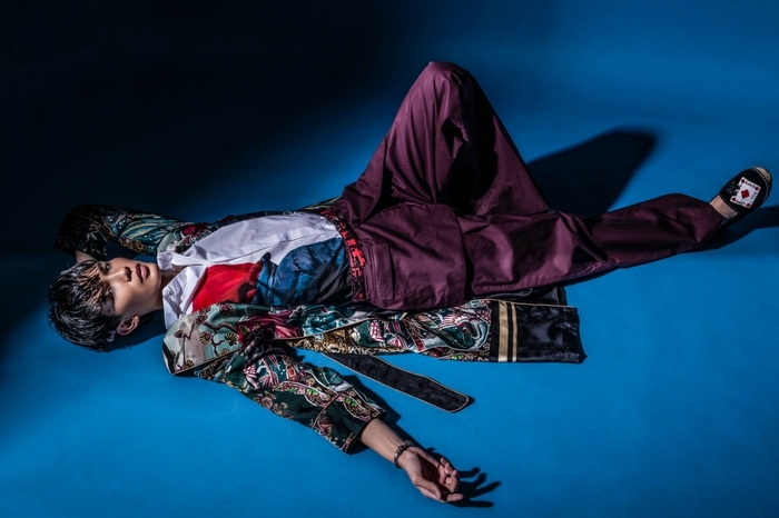 Printed pajama coat and embroidered espadrilles in velvet, by D&G; François Bard printed shirt, trousers by Dior Homme; Printed leather belt by Prada; Silver bracelet by Gucci Image