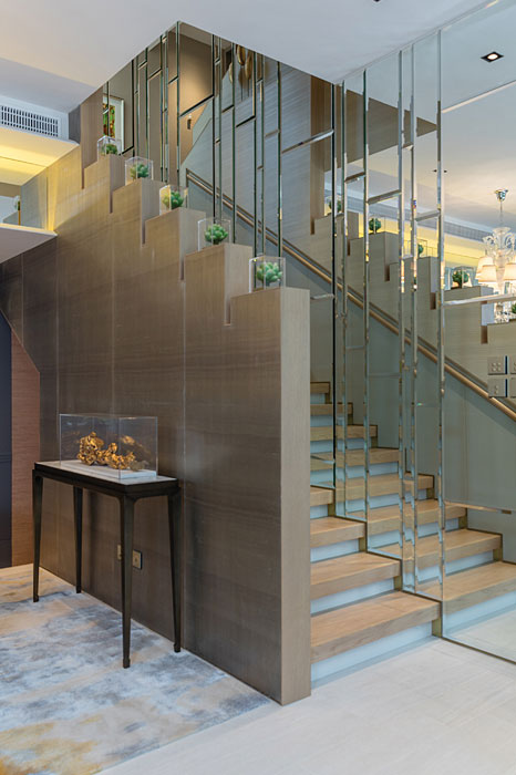 Well-positioned wall mirrors reallocate natural light to more remote corners of the Mayfair