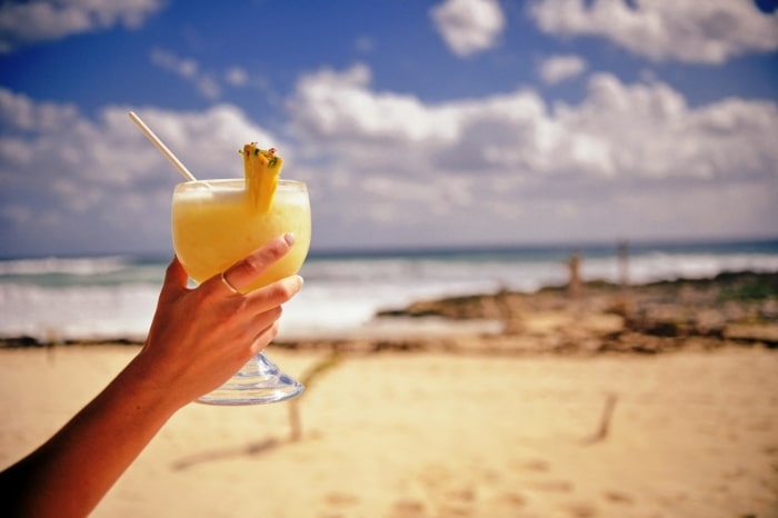 After exploring your fill, relax on a Taveuni beach with a cocktail in hand