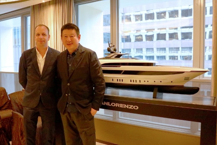 Zhou Chunya posing with Sanlorenzo yacht